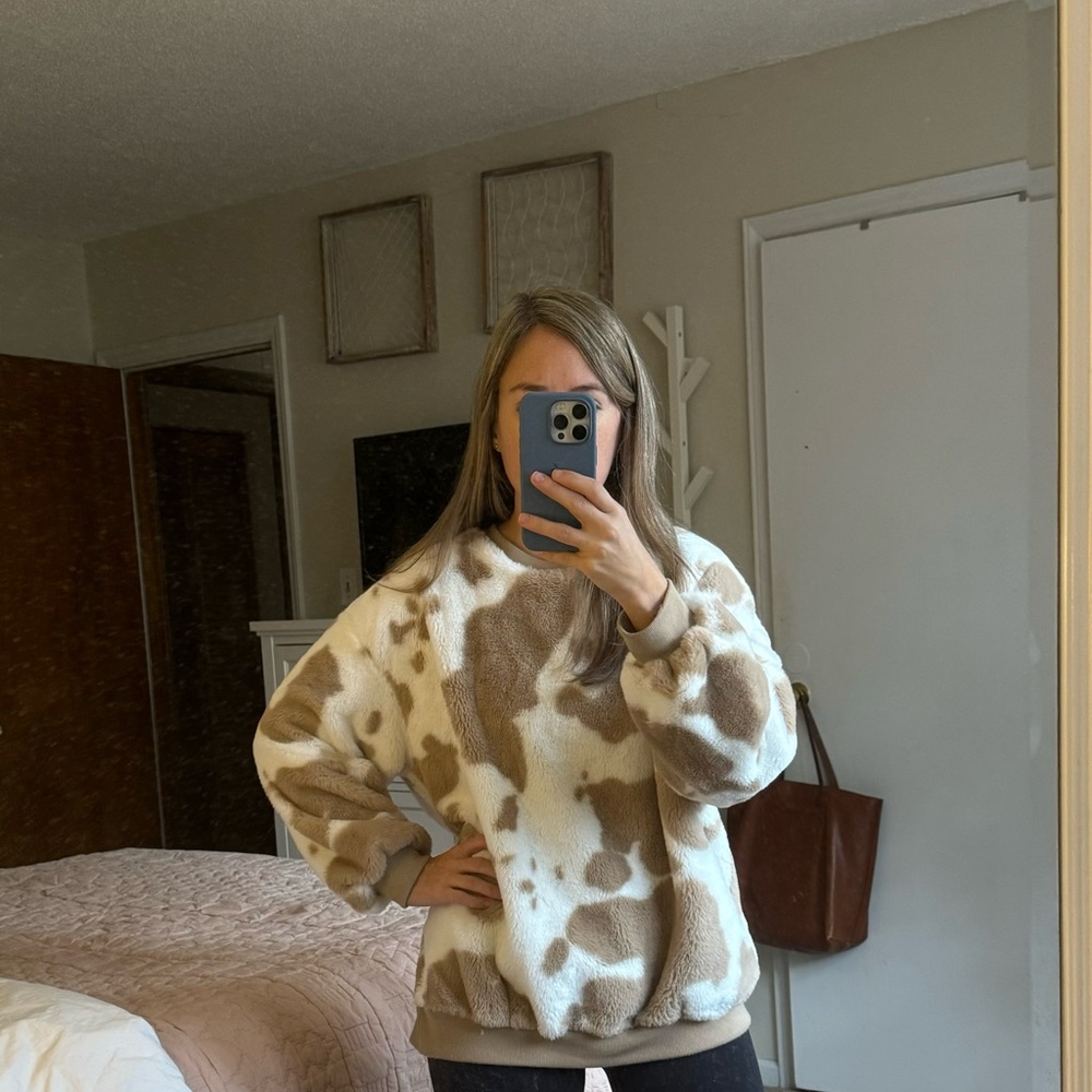 Fuzzy tan and white cow print sweatshirt from Vestique, size small